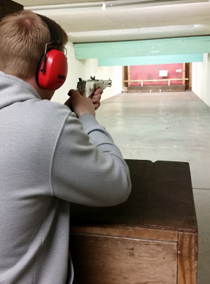 Precision shooting session focusing on firearm safety and handling